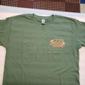 A green t-shirt with a brown logo on it.