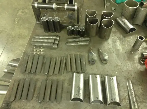 A table with many different metal parts on it
