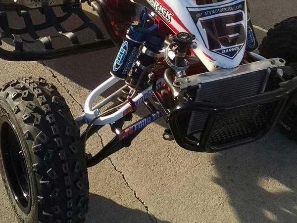A close up of the front tire on a dirt bike
