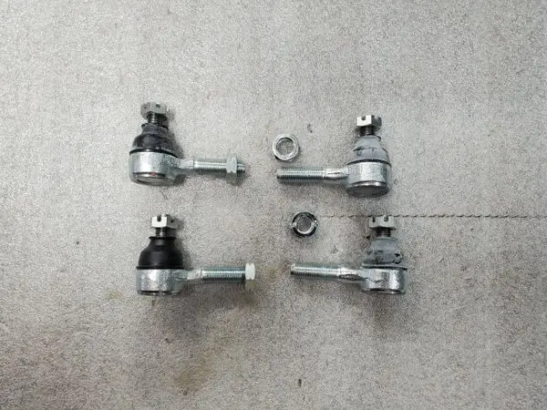 A set of four ball joints on the floor.