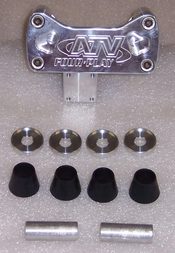 A set of four black rubber feet and six metal washers.