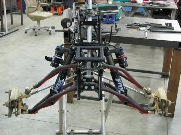 A close up of the front suspension on a car