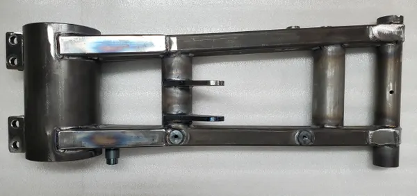 A metal frame with two different parts attached to it.