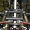 A close up of the front suspension on a motorcycle.