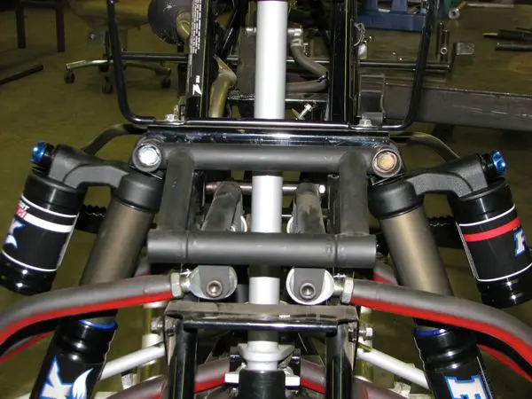 A close up of the front suspension on a motorcycle.
