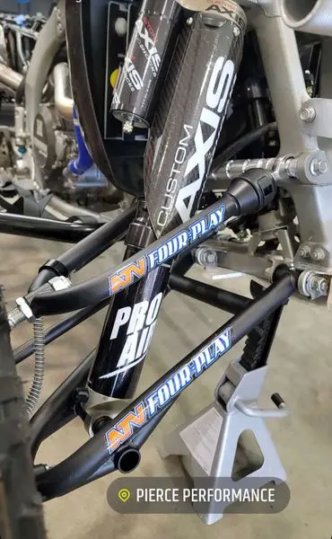 A close up of the front forks on a bike.